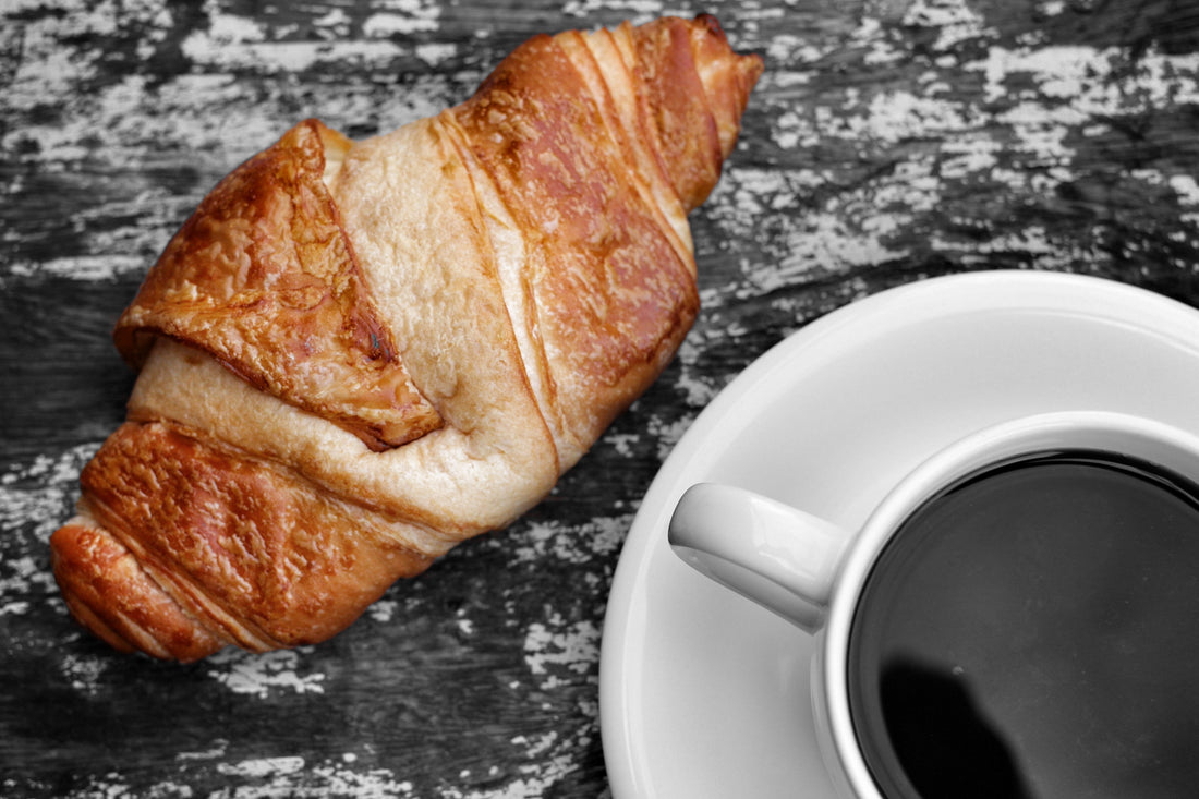 Blog on Inspiration for curated Gift Boxes. Photo of coffee and coissant.