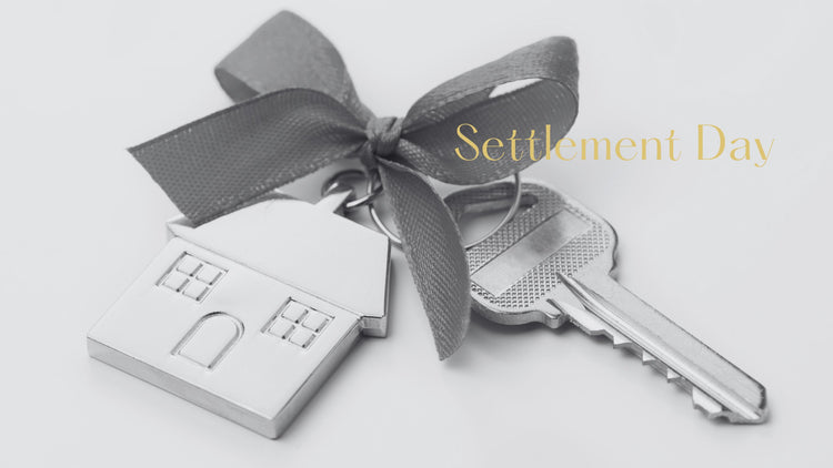 Flat lay of the most popular real estate gifts with a wine, board, honey, oil, napkins and chocolates.