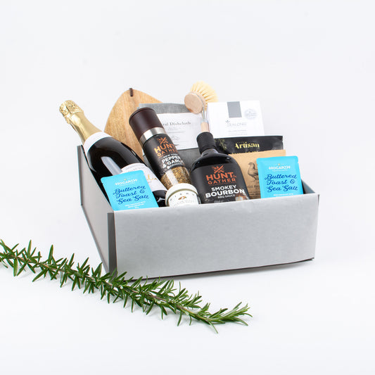 Gift Box includes with bubbles, pepper grinder, craft chocolate,artisan olives, spices,kitchen accessories and wooden board.