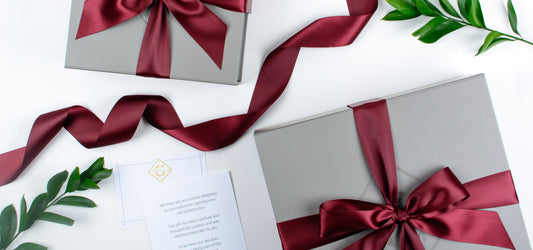 Settlement Gift Boxes with satin ribbon and card.