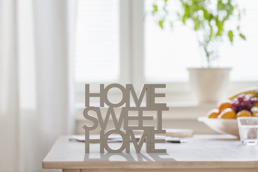 Plaque saying Home Sweet Home.  Blog features tips on how to increase the value of your home.  Curated gift boxes for real estate professionals. 
