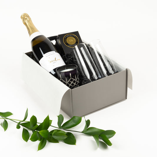Cheers gift box with bubbles, two stemless champagne flutes, and NZ-made scented candle , an elegant celebration gift NZ