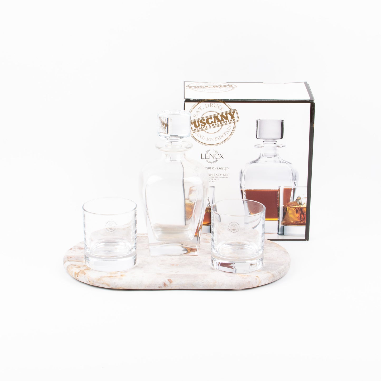 A Tuscany whisky 3 piece set with a decanter, two glasses, and a box packaging, displayed on a marble board (not included).
