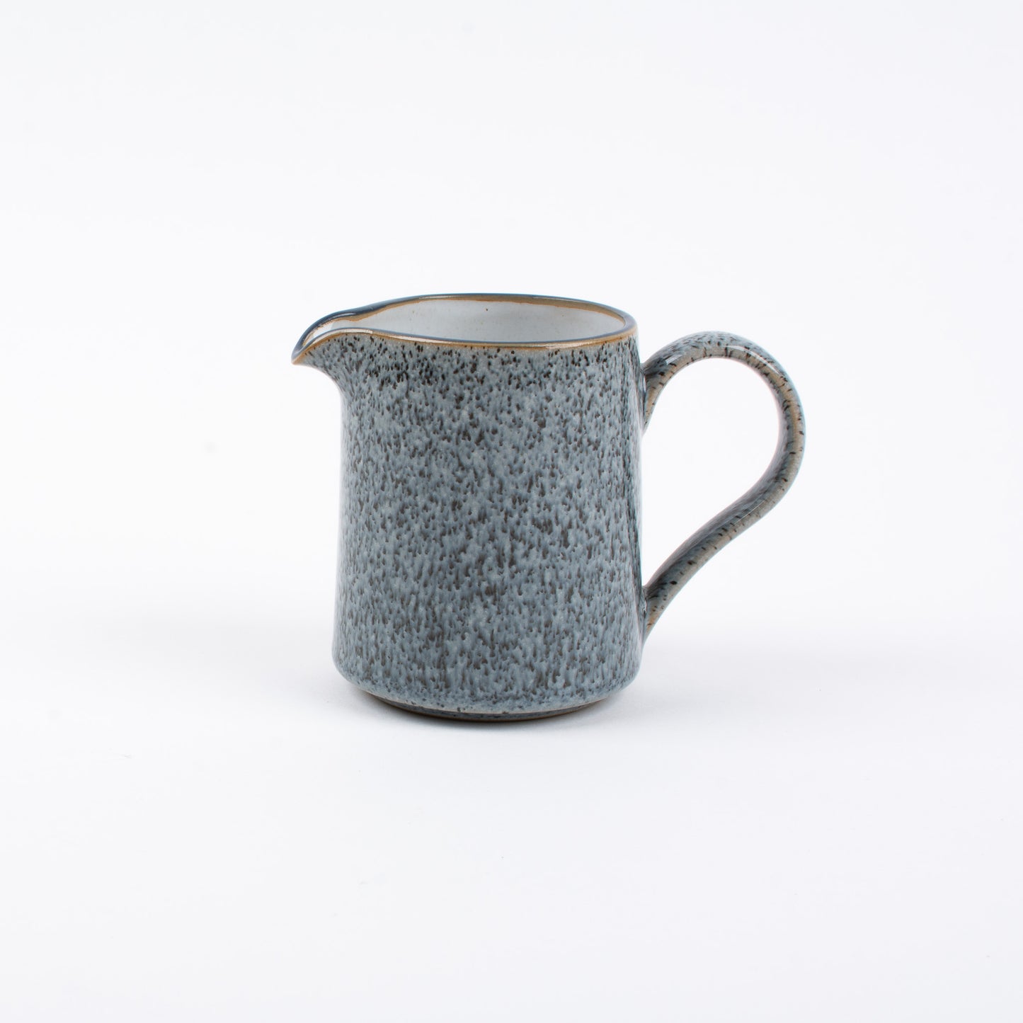 A blue Denby ceramic jug with a handle, placed against a white background.