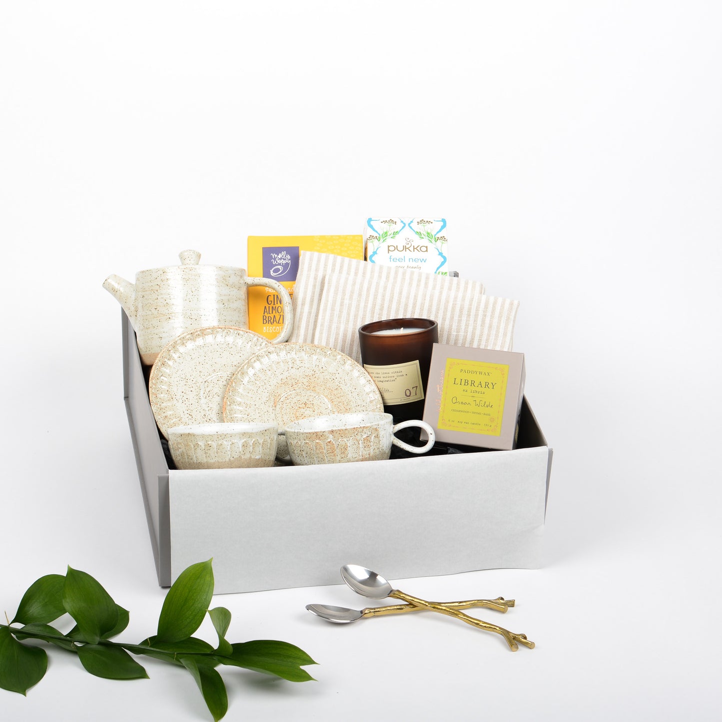 Gift Box includes a set of pottery tea cups, tea pot by Robert Gordon, biscott and candle with set of tig design spoons.