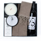 Gift box includes two hand towels, two facecloths, red wine, candle, hand wash.