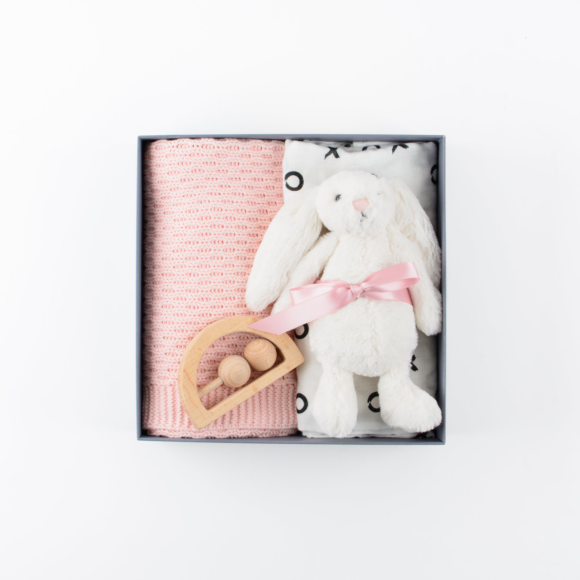 Gift box includes soft toy, blanket, swaddle, wooden teether.