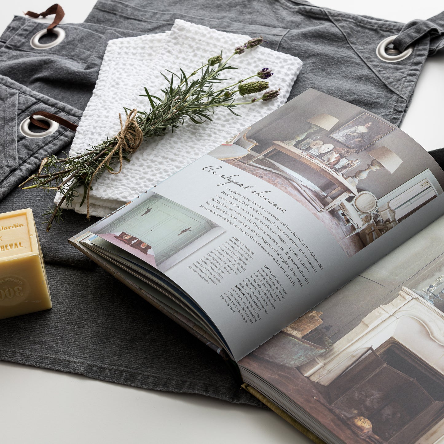 Close up of french decor book, soap and apron.