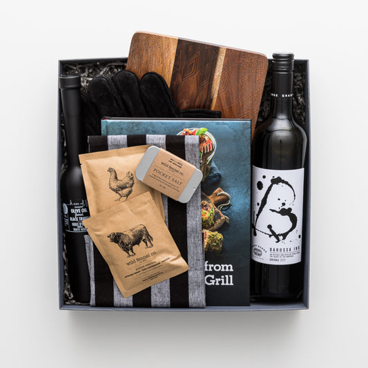 Gift box includes cook book, red wine, seasoning, truffle oil, leather glove, tea towel and wooden board.
