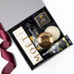 Moet champagne, hygge candle, bubbly bears, hand wash and hand cream are in custom gift box with ribbon.