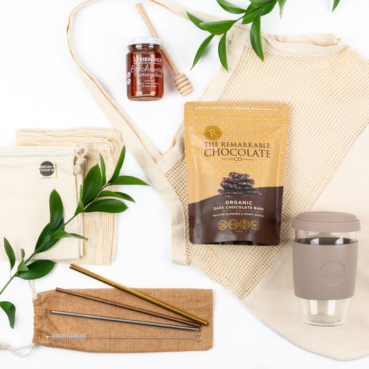 Products featured out of gift box are organic cotton totes, SOL reusable straws, award winning honey and dipper, SOL reusuable cup.  Natural and sustainable products in a custom gift box.
