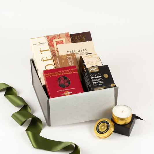 Festive treats and small Moet and travel candle in gift box