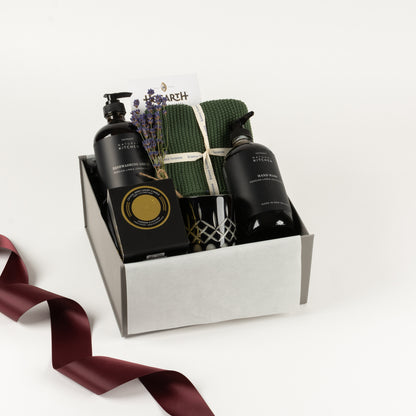  Included in this gift box are a set of cotton washers, natural hand wash, dish wash, crystal candle by Surmanti and craft chocolate tablet by Hogarth.