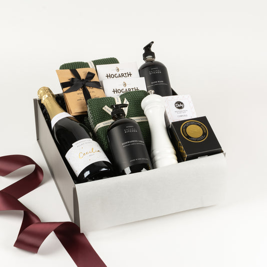 Kitchen Collection Deluxe - Gift Boxes NZ - Gifts of Distinction.  This gift box features natural hand wash, dish wash, crystal candle by Surmanti, spices, craft chocolate, cotton washers, cotton towel, white grinder.