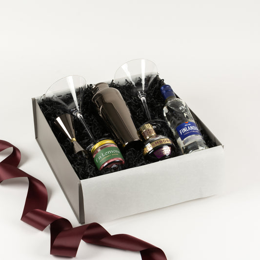French Martini - Gift Boxes NZ - Gifts of Distinction.  Featured in this gift box are 2 martini glasses, parisienne cocktail shaker and jigger, cocktail garnish, chambord and vodka.