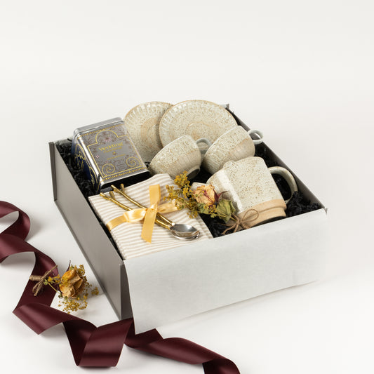 Blissful Mornings - Gift Boxes NZ - Gifts of Distinction.  This wedding gift box includes a set of stoneware tea cup and saucers and matching tea pot, pure linen napkins, spoons and wedding tea by Harney and Sons.