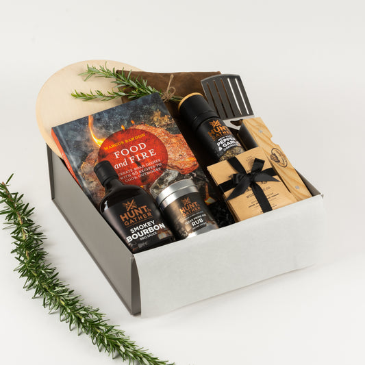 BBQ Lovers Grande - Gift Boxes NZ - Gifts of Distinction.  Gift box features leather BBQ apron, wooden board, cookbook, BBQ multi tool and a selection of spices.