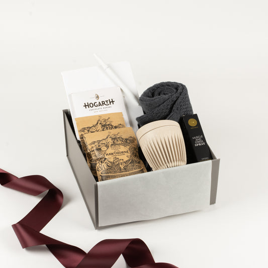 Select Her - Gift Boxes NZ - Gifts of Distinction.  Included in this gift box are merino socks by Lamington, notebook with pen, reusable cup, muscle and stress spray by Surmanti, craft chocolate and Hawthorne coffee sachets.